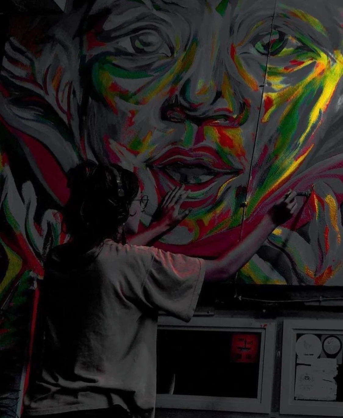 Shalagh Quinn at work on a mural portrait